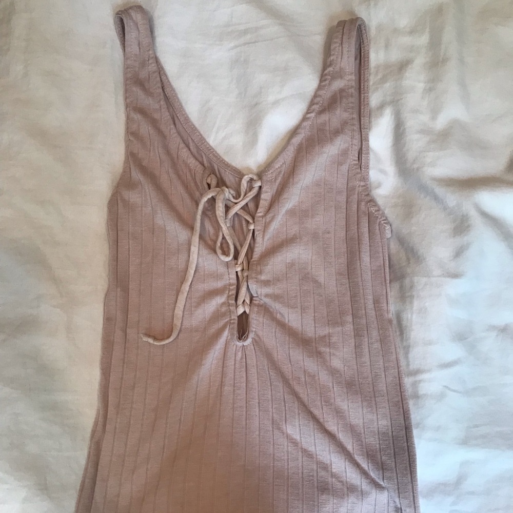 Tight light pink shirt